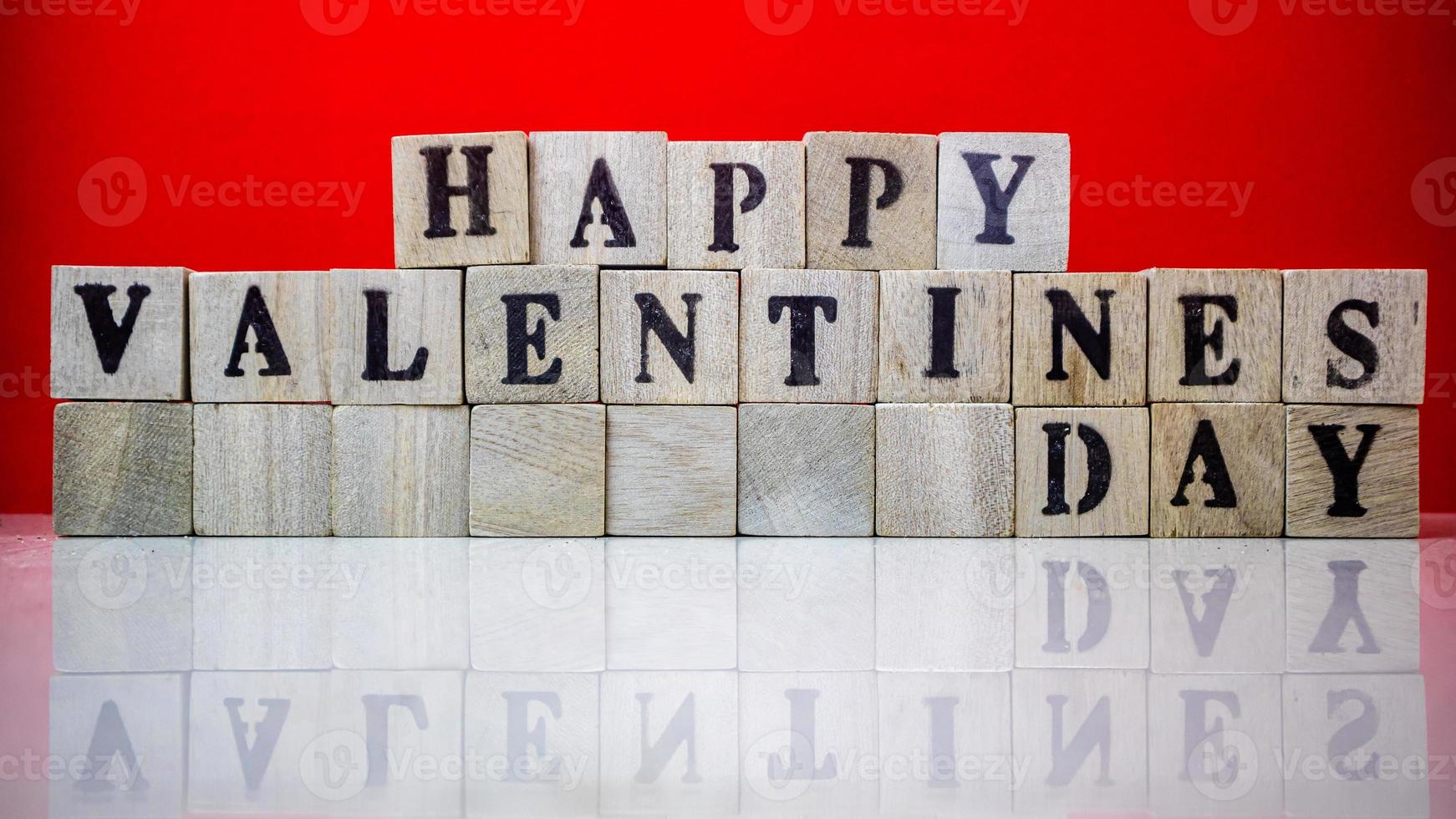 Happy valentine day on wooden blocks photo
