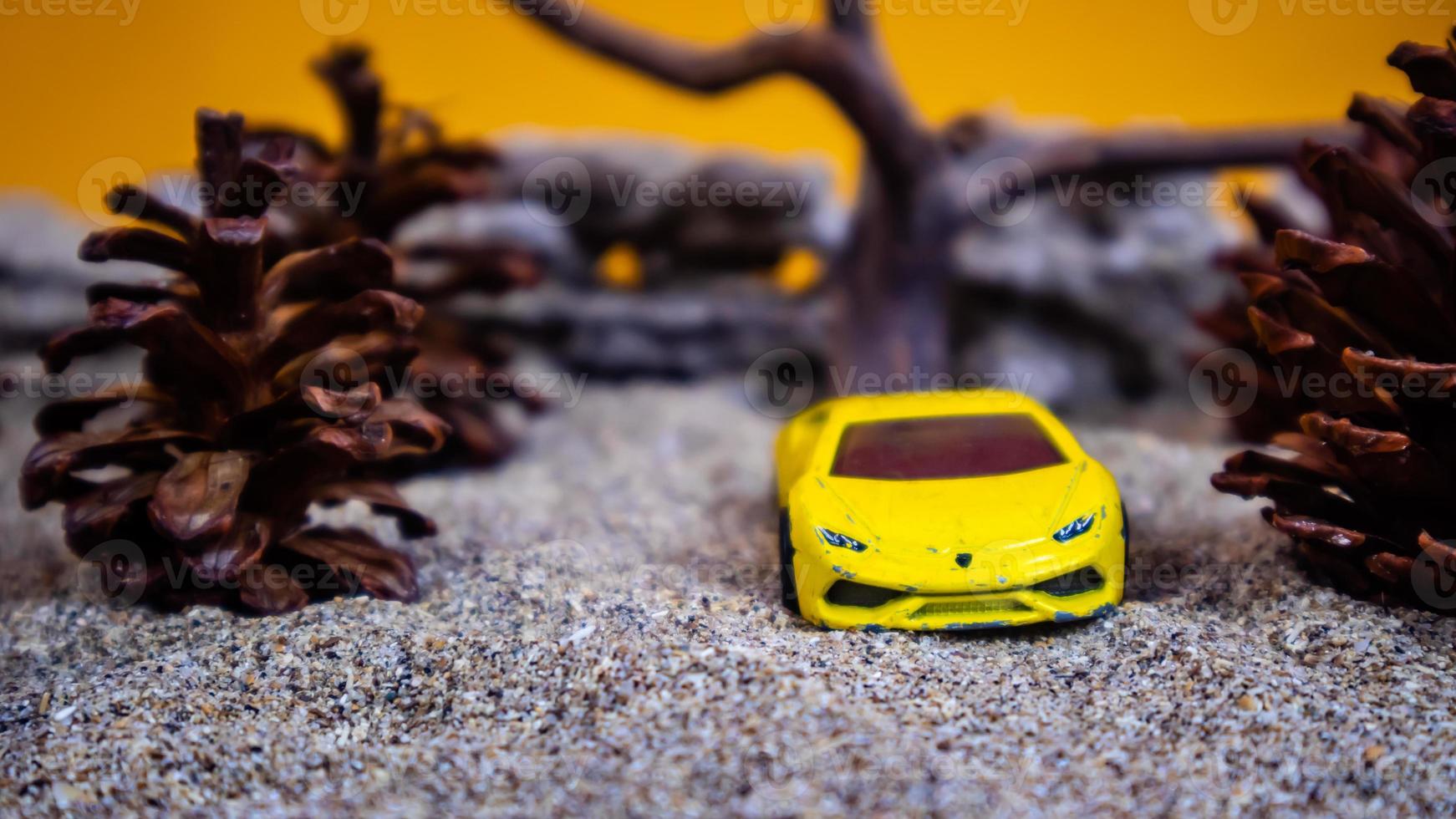 Minahasa, Indonesia  saturday, December 2022, a toy car among the pinecones photo