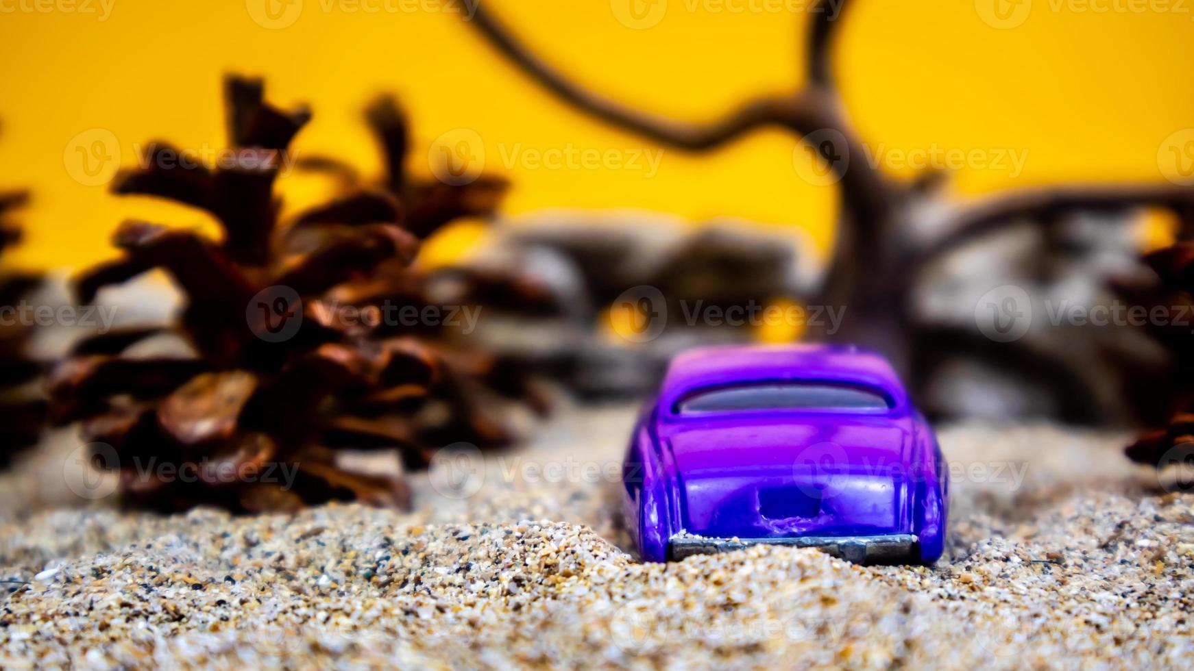 Minahasa, Indonesia  saturday, December 2022, a toy car among the pinecones photo