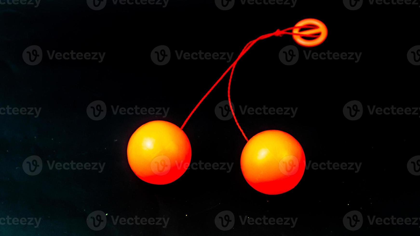 toy lato lato orange on black background photo