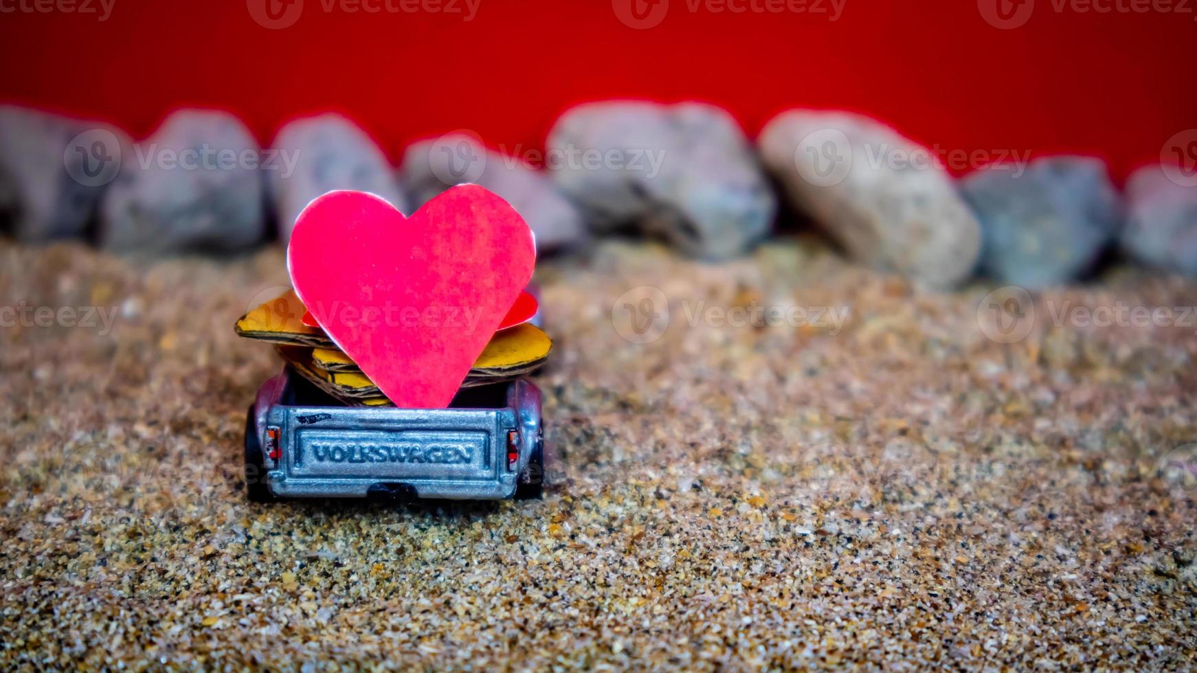 Minahasa, Indonesia December 2022, the toy cars transporting hearts photo