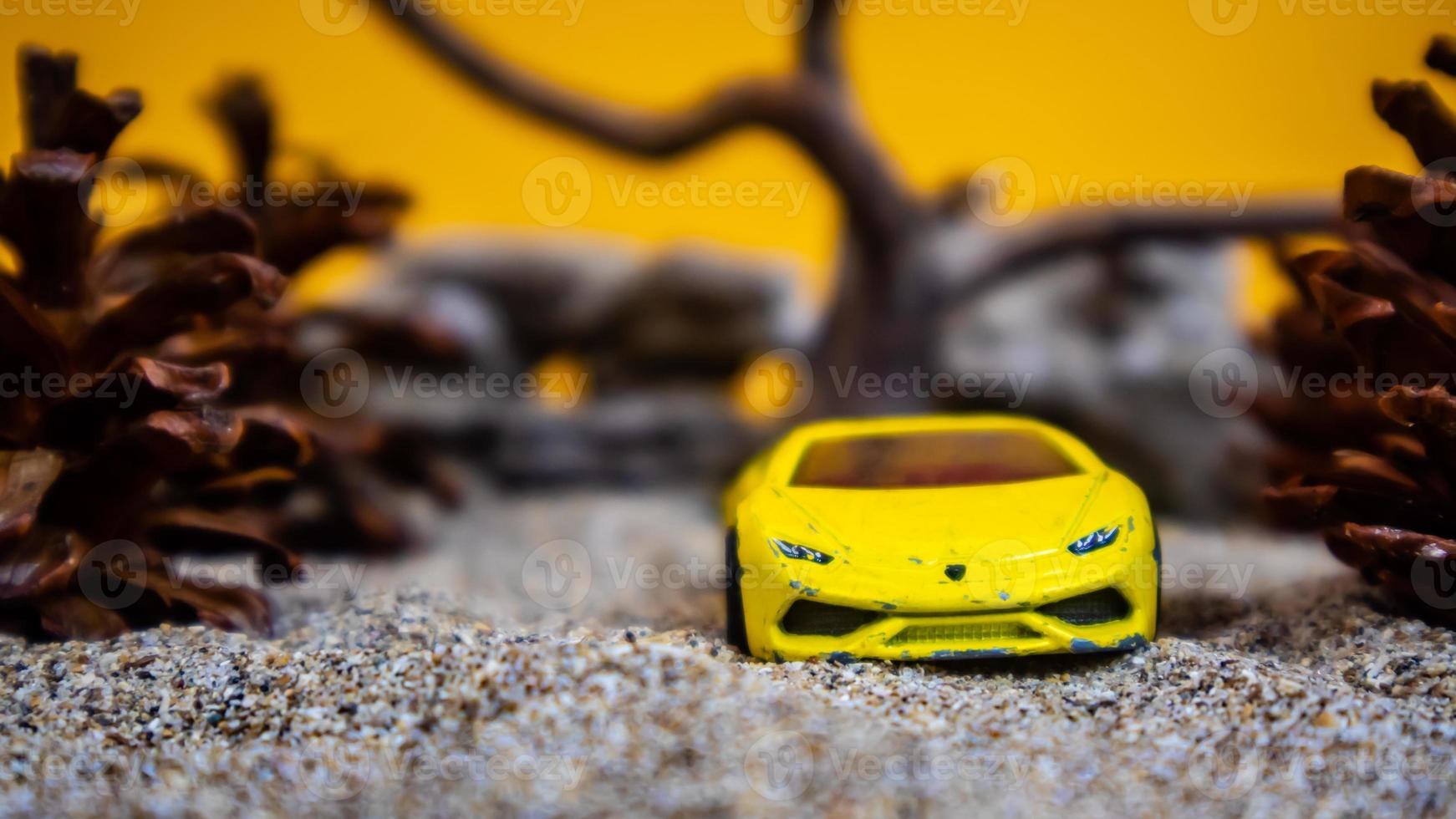 Minahasa, Indonesia  saturday, December 2022, a toy car among the pinecones photo