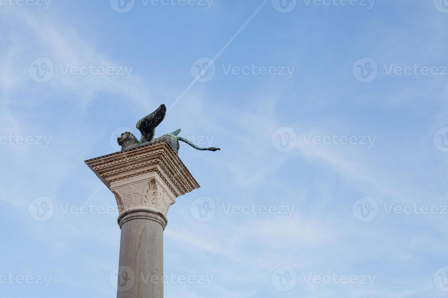 The Winged Lion of Venice on top of the column of San Marco, Venice - Italy photo