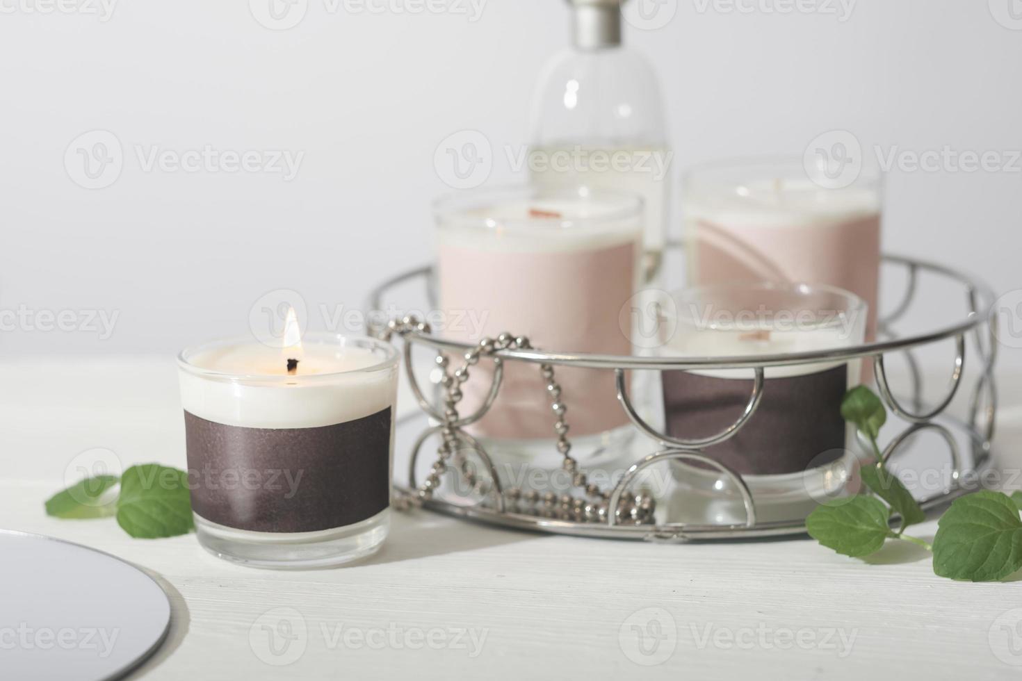 set of various aroma candles in glass jars. Scented handmade candle. burning soy candles. Aromatherapy and decor for home. photo