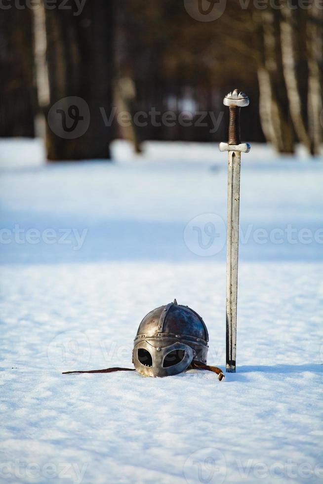 Image of silver sword and helmet fantasy medieval period photo