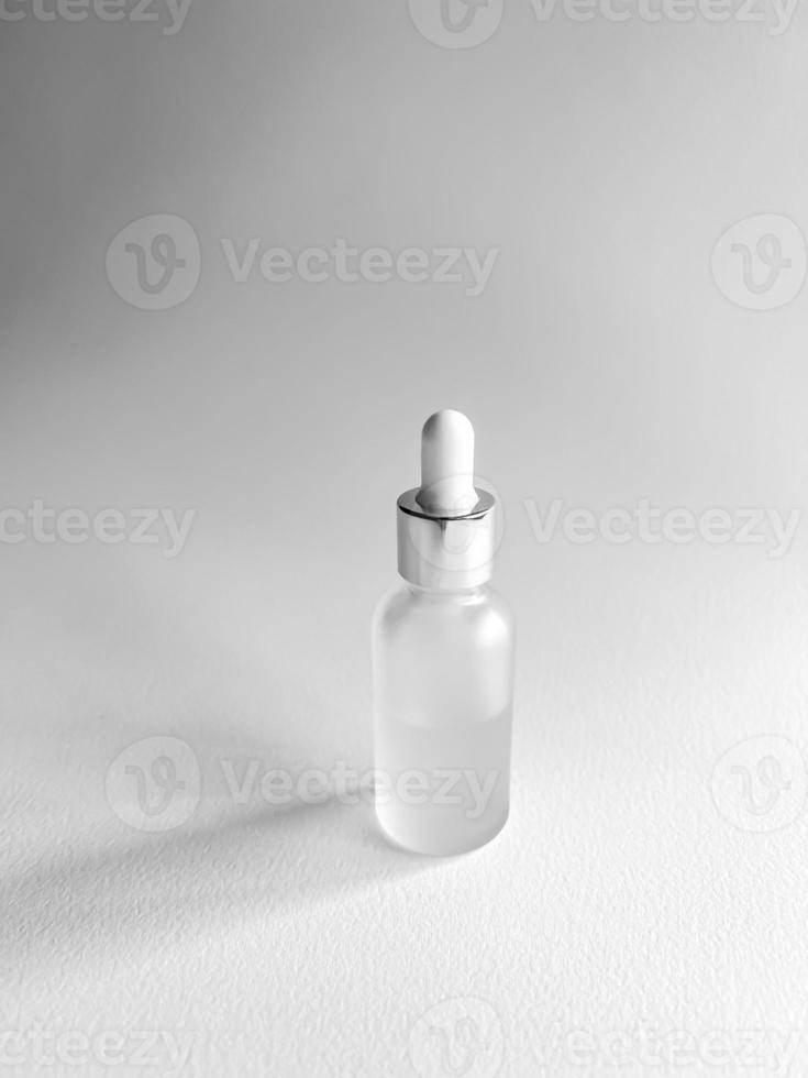 bottle of perfume. Facial serum photo