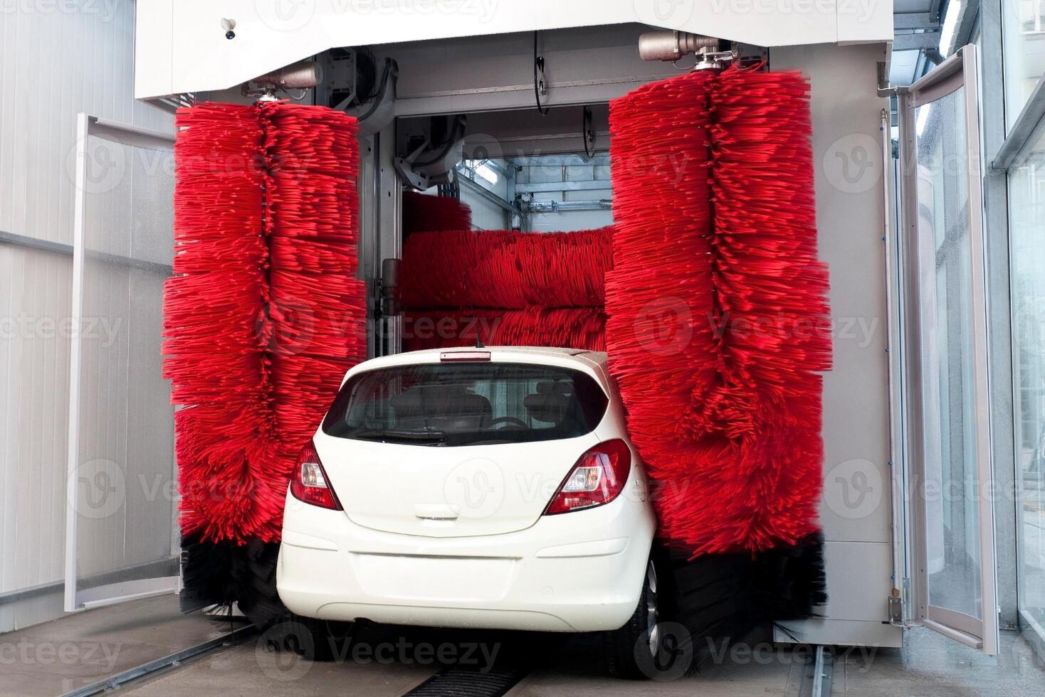 Worker washing car with sponge on a car wash, Manual car wash with white soap, Car wash self