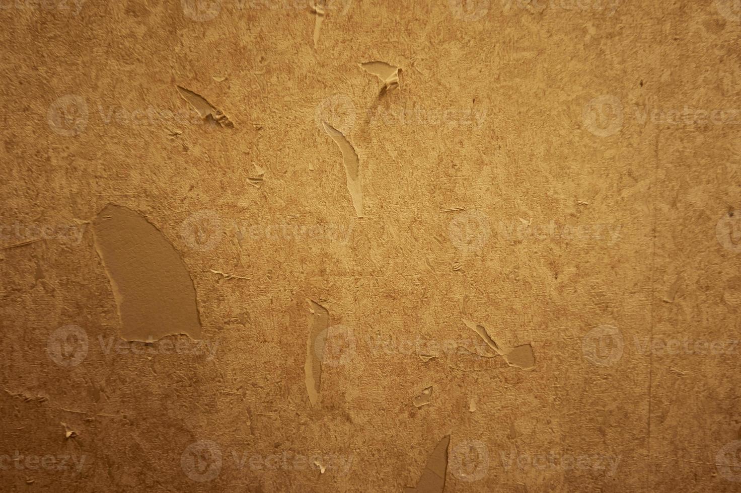 Close up of torn or ripped wallpaper. Hole in the wallpaper on the wall. Old faded floral wallpaper teared down or peeling off walls of the house for general background. Front view close up details. photo