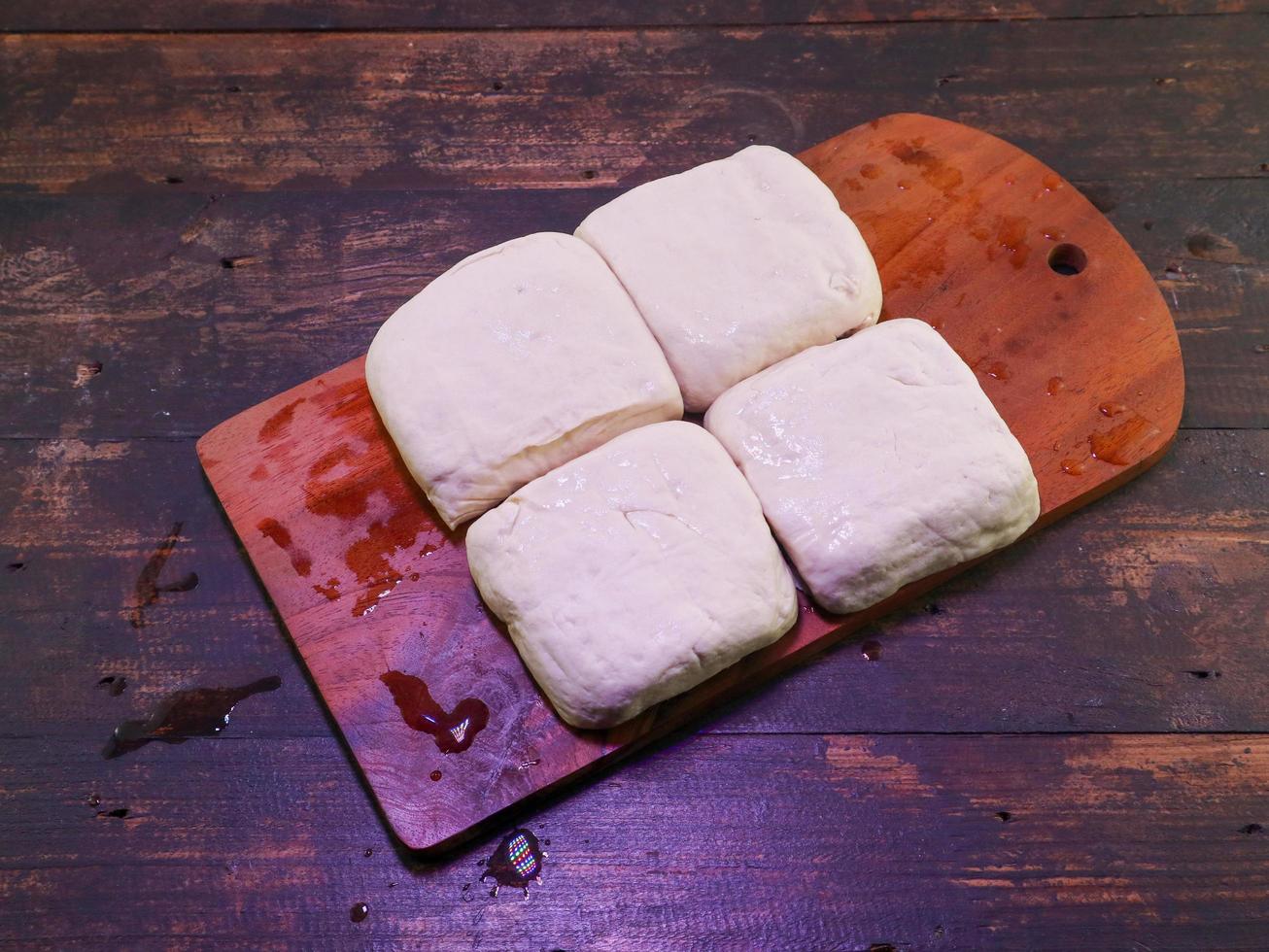 Block of white tofu on a wooden plate photo