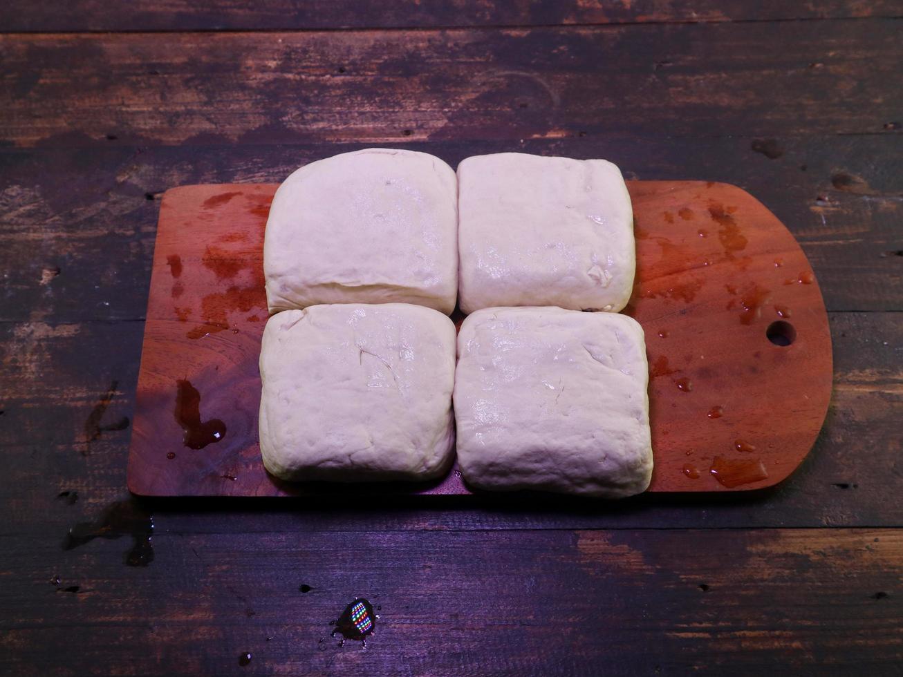 Block of white tofu on a wooden plate photo