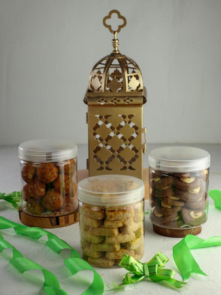 Indonesian famous cake for celebrate Ied Mubarak, famous cookies in a jar with a pink clear background. selective focus photo