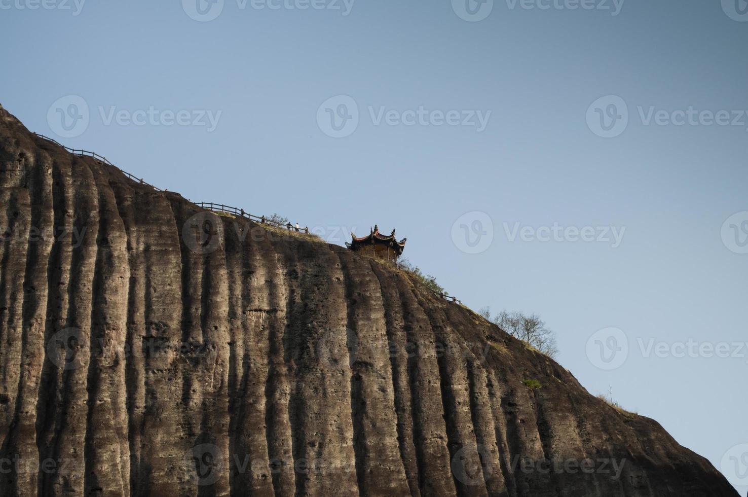 One side of a mountain which is almost 90 degree vertical photo