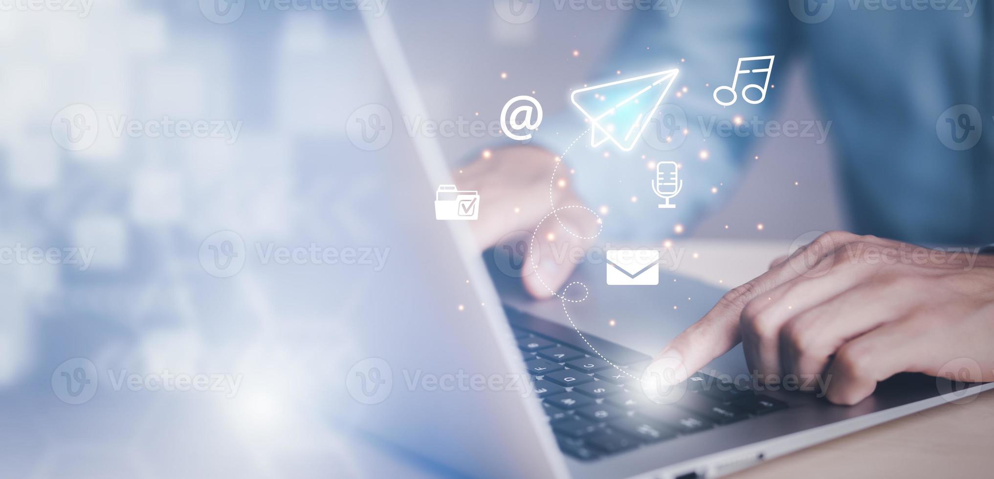 businessman hand type on the laptop with communication icons, letter icon, email icons, and newsletter email and protect your personal information or spam mail, Customer service call center contact. photo