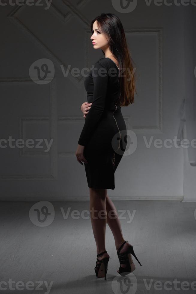 Portrait of a cute brunette posing in the studio photo
