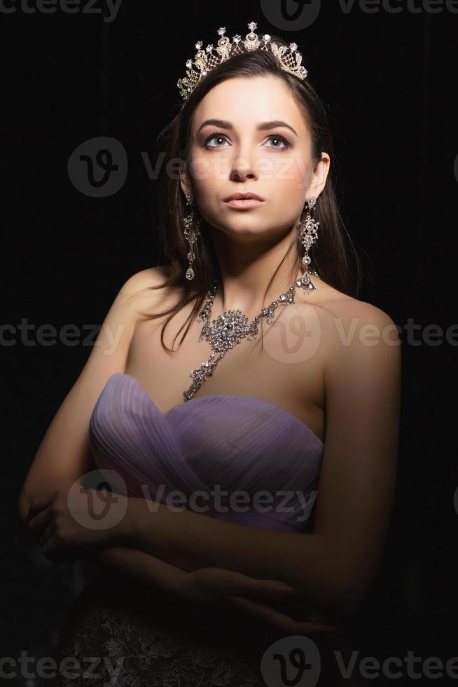 Pretty brunette posing in the studio photo