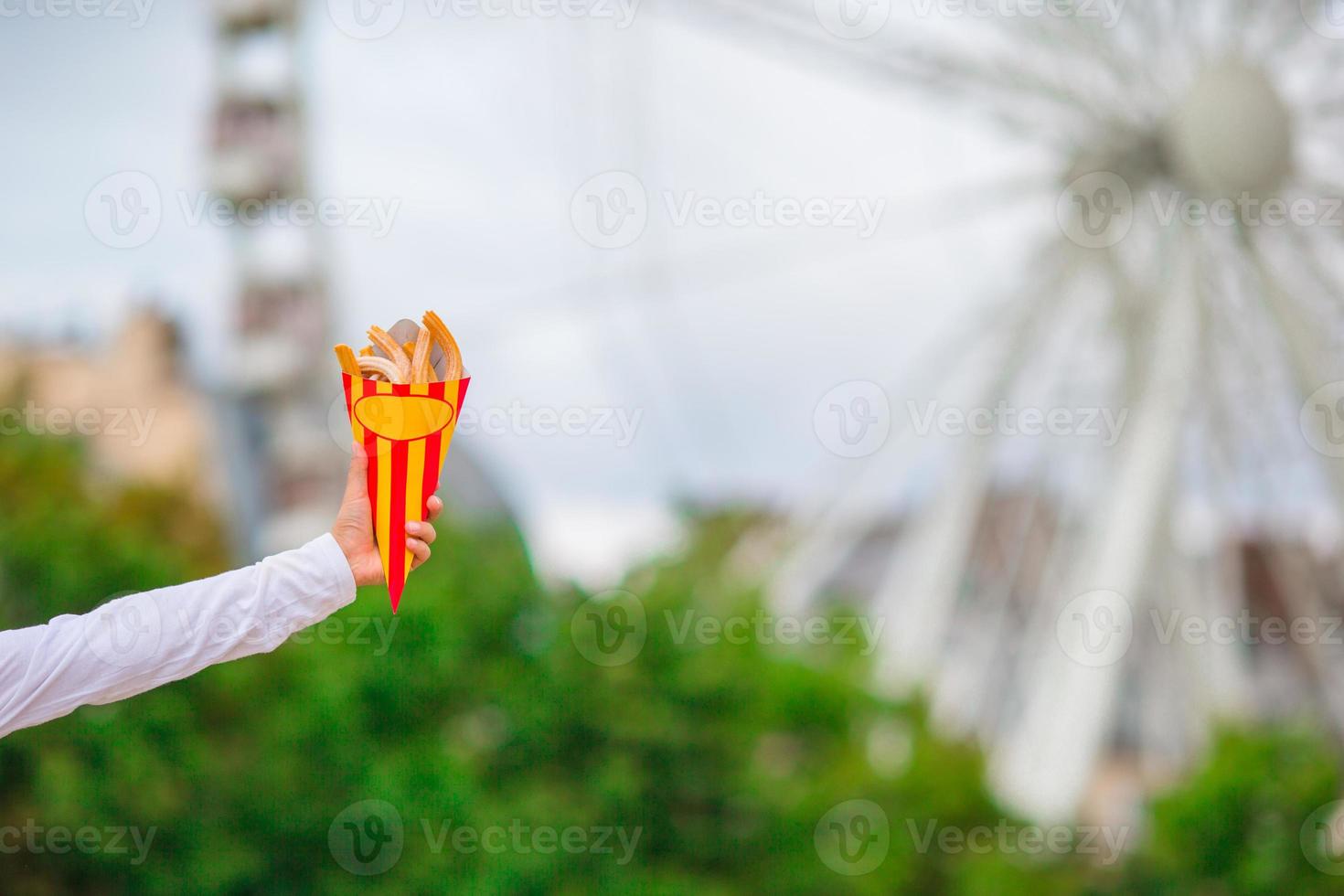 Hand holding churros photo