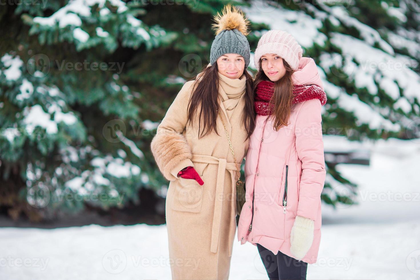 Women having fun on the snow photo