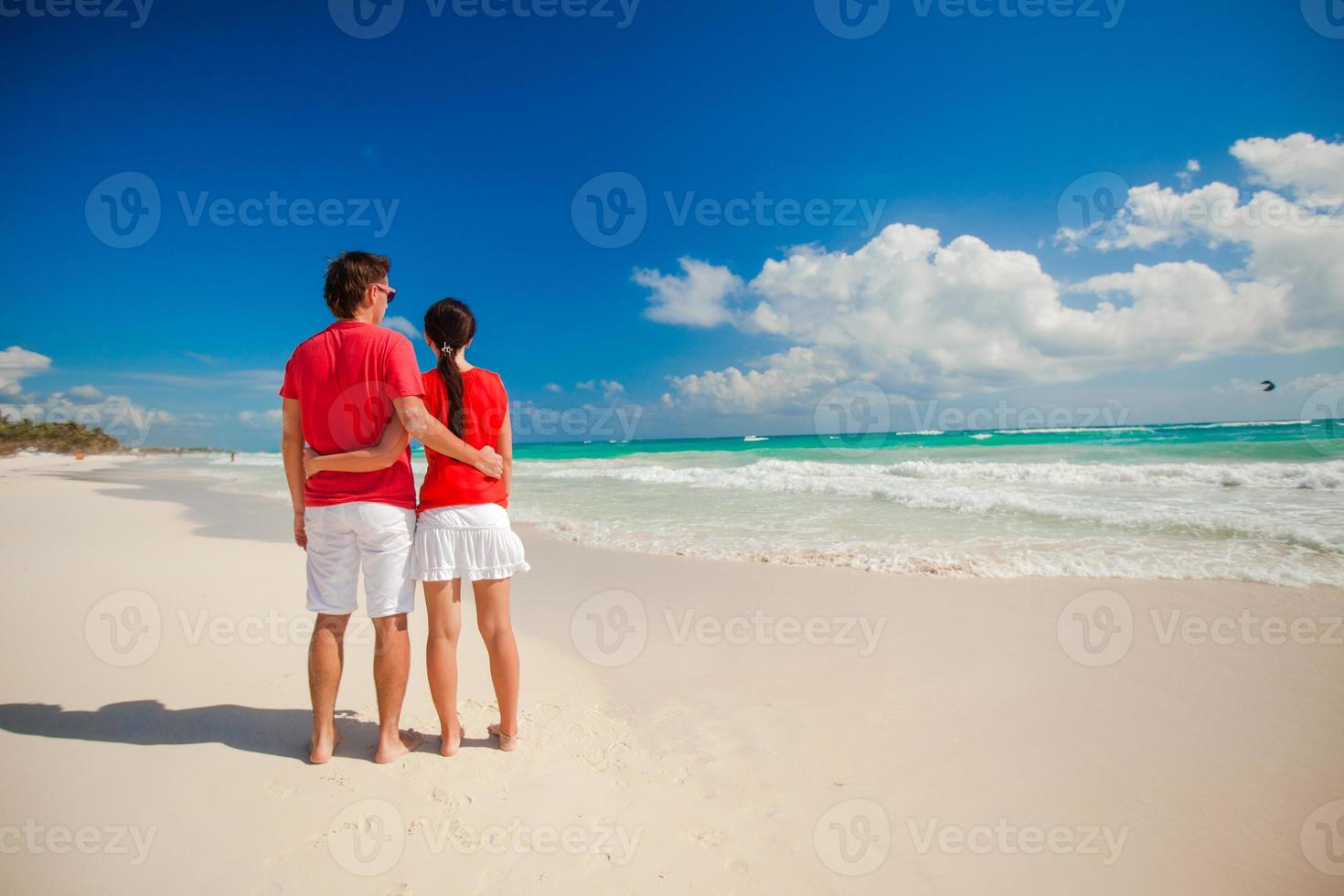 Beautiful young couple at the beach photo
