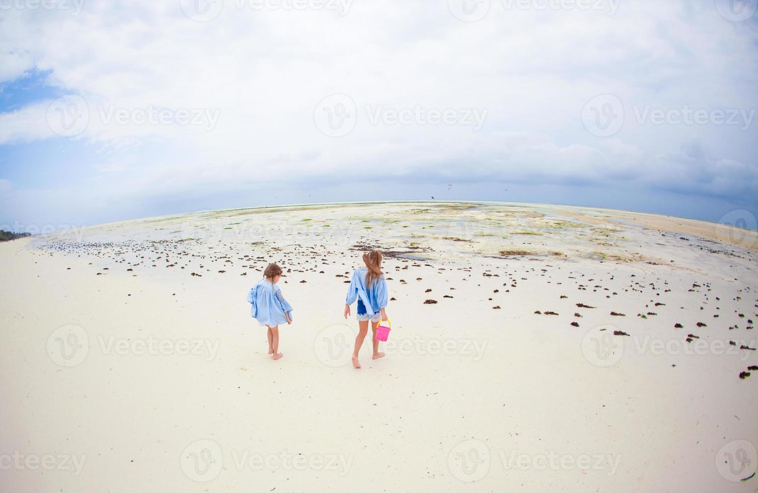 Little girls on the beach photo