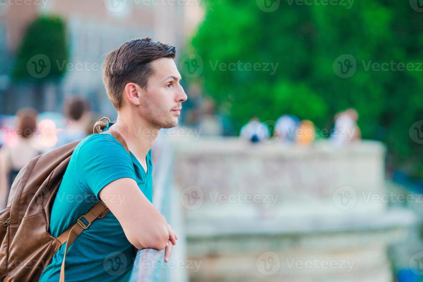 Young man with backpack photo