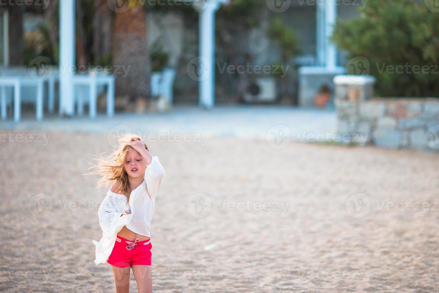 Little girl on the beach photo