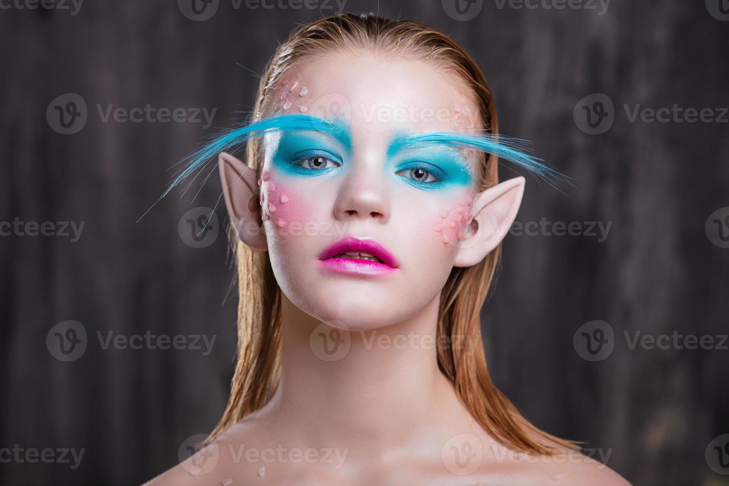 Young lovely girl with creative makeup photo