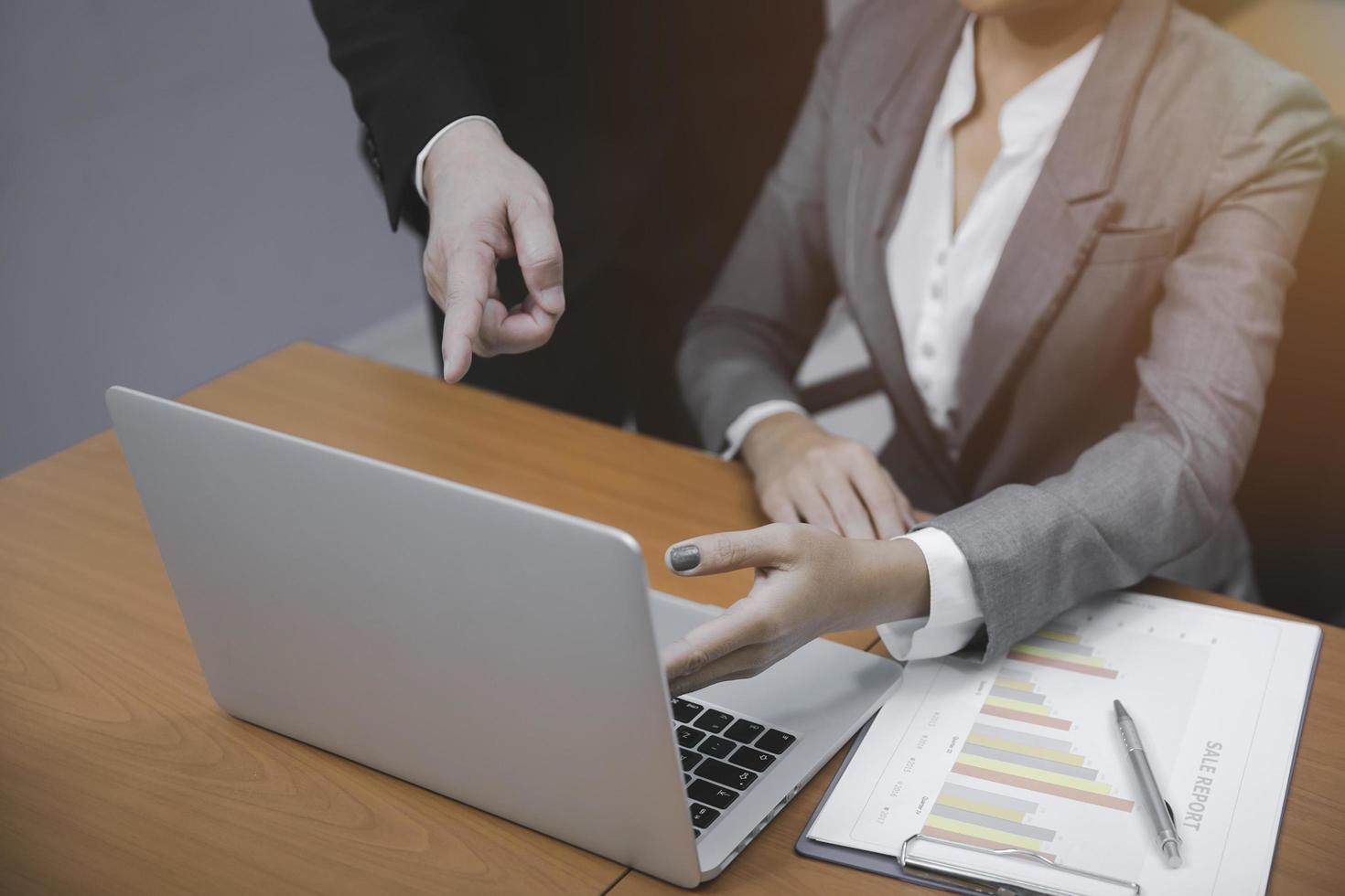 Business men and women presenting financial results photo