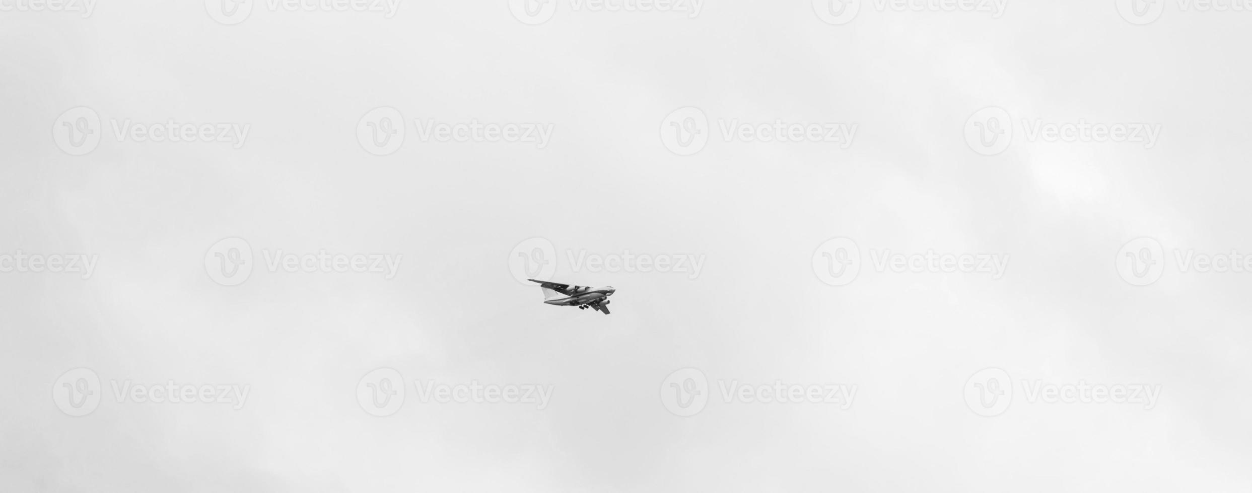 aircraft in gray sky photo