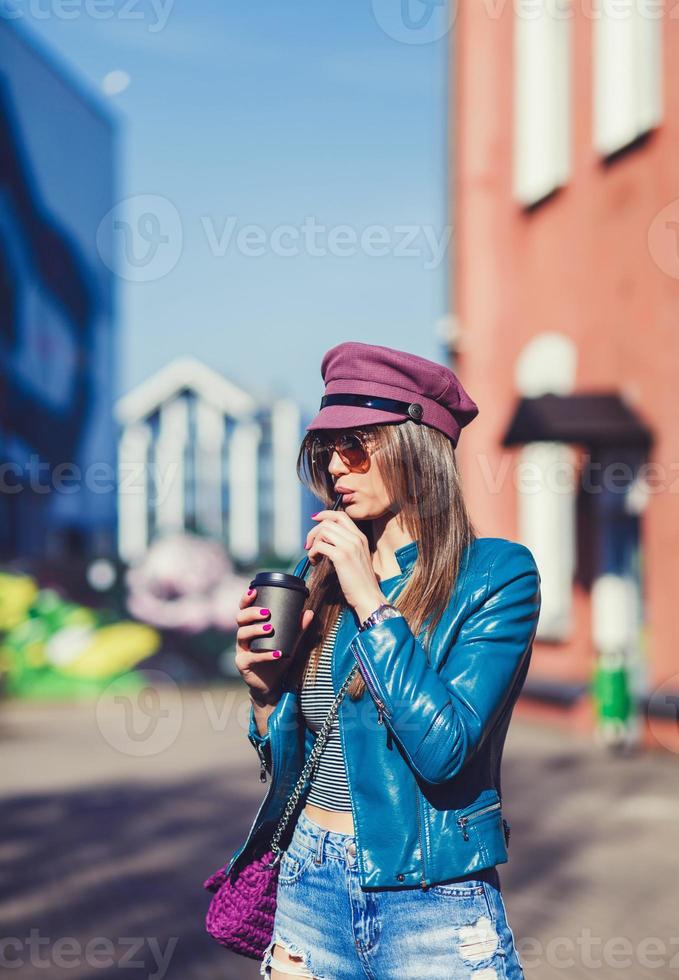 woman in the street drinking coffee photo