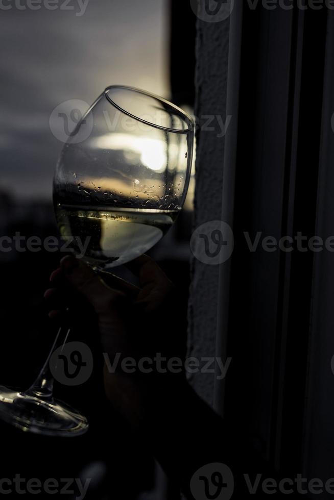 Vine glass in woman hand. photo