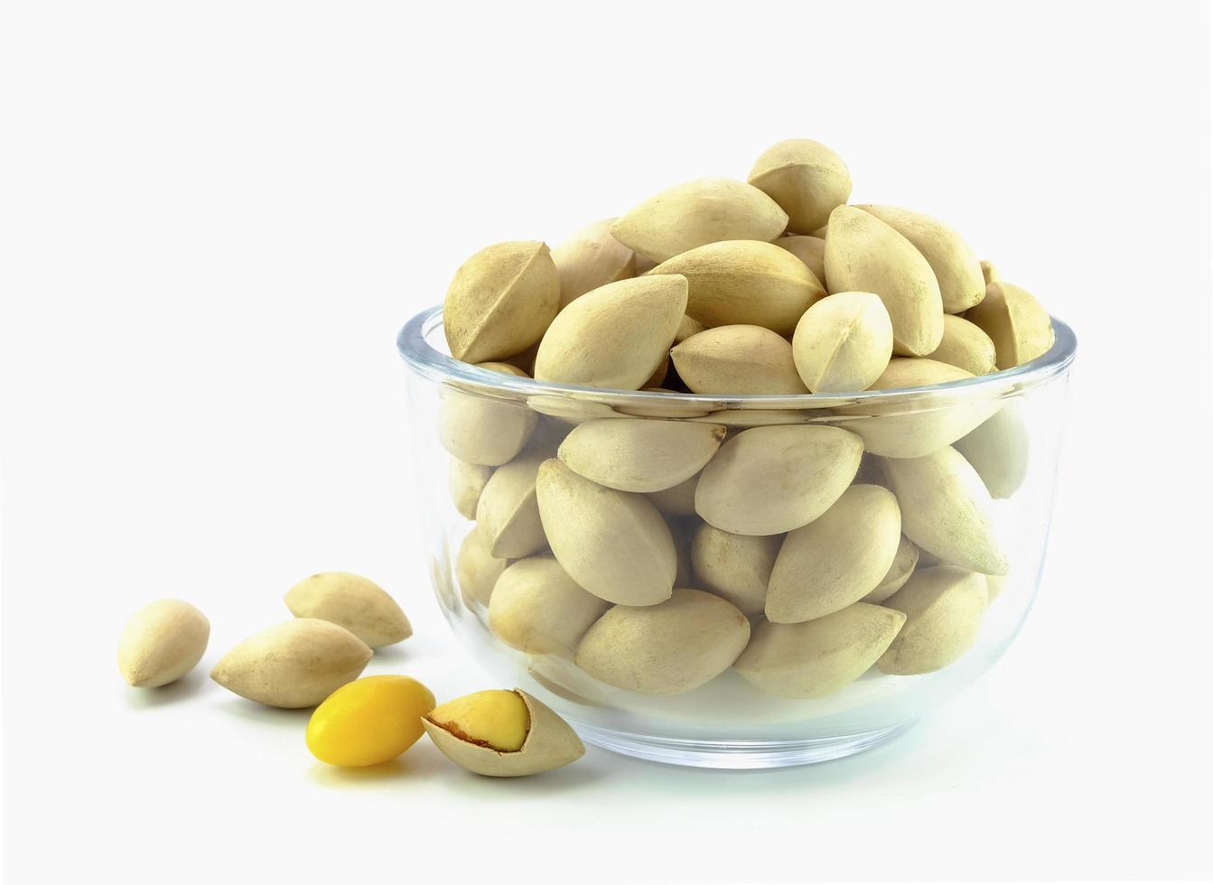 ginkgo biloba nut with shell in glass bowl photo