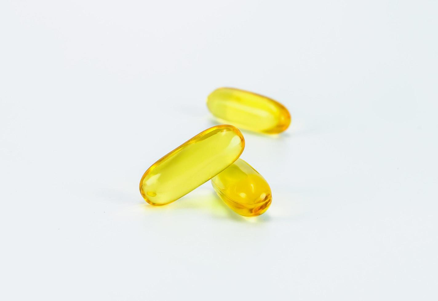 fish oil pill on white background photo
