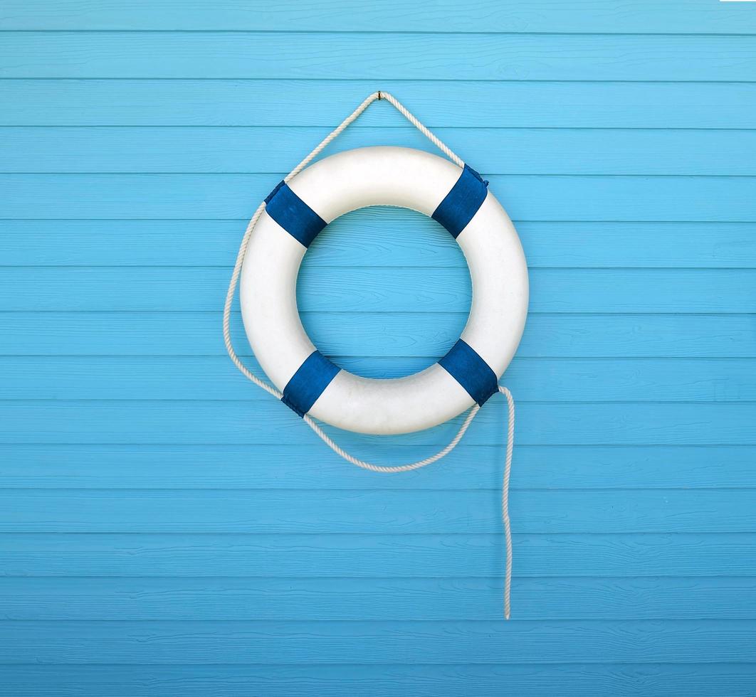 lifebuoy on a blue wall photo