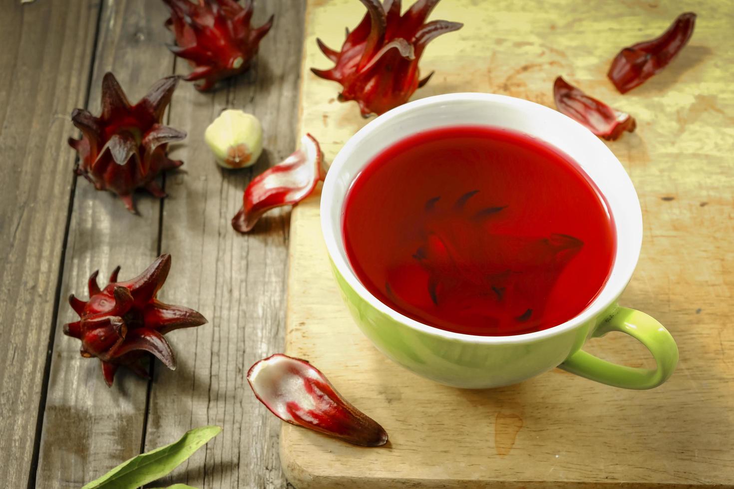 roselle drinking  on wooden background photo