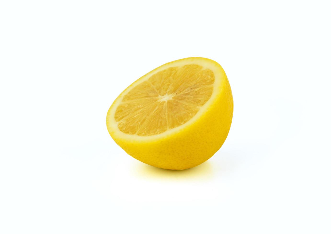 lemon cutting half on white photo