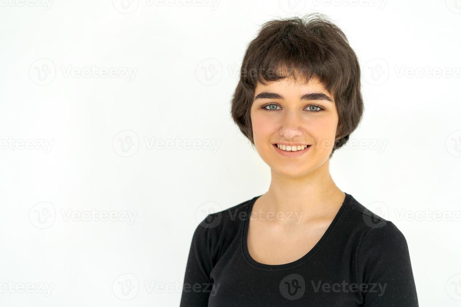 Portrait charming young woman in black clothes smiling broadly with white teeth photo