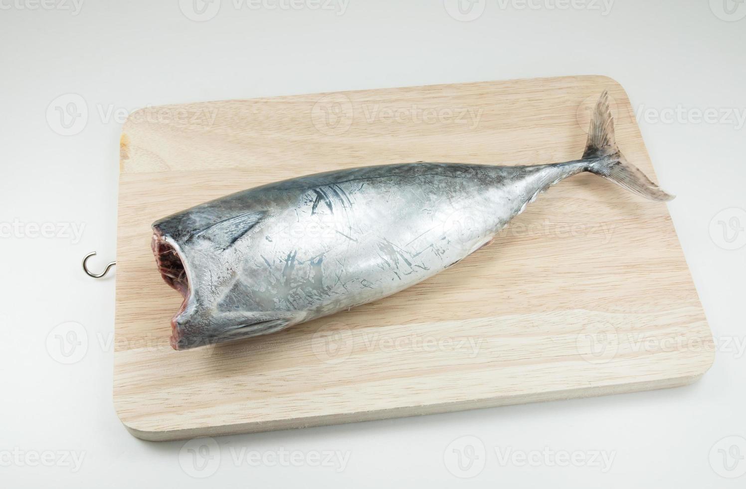 Tuna fish raw on Wooden floor on white background photo