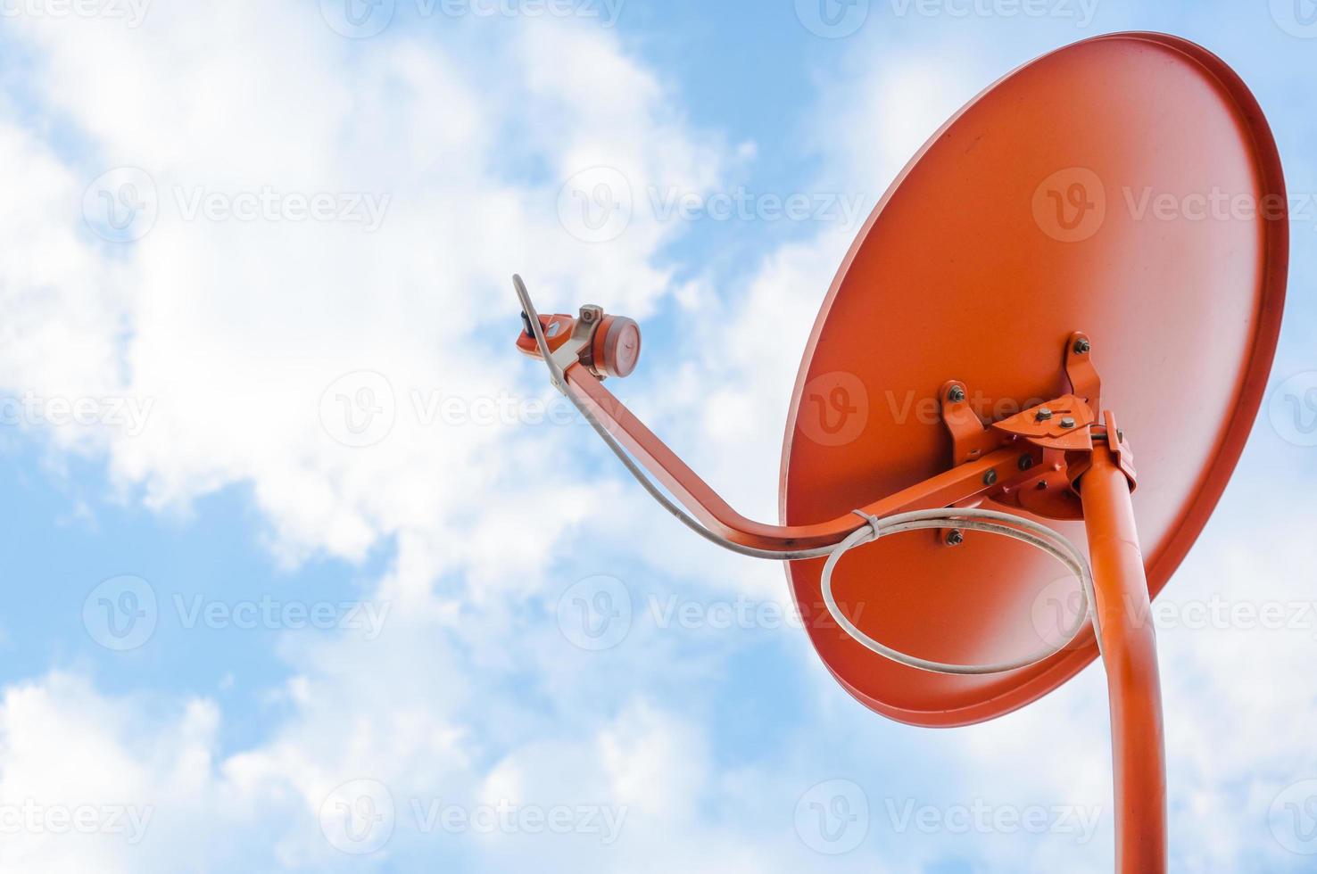 Orange Satellite dish on background  blue sky with cloud photo