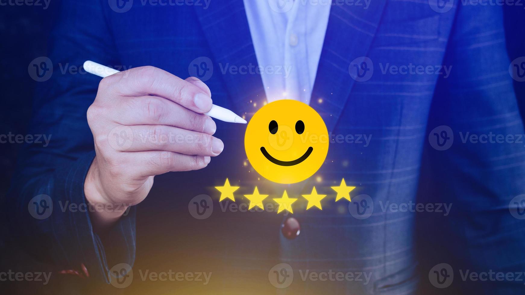 Customer services best excellent business rating experience, Positive Review and Feedback, Satisfaction survey concept. Hand of a businessman show happy smile face with five star. photo