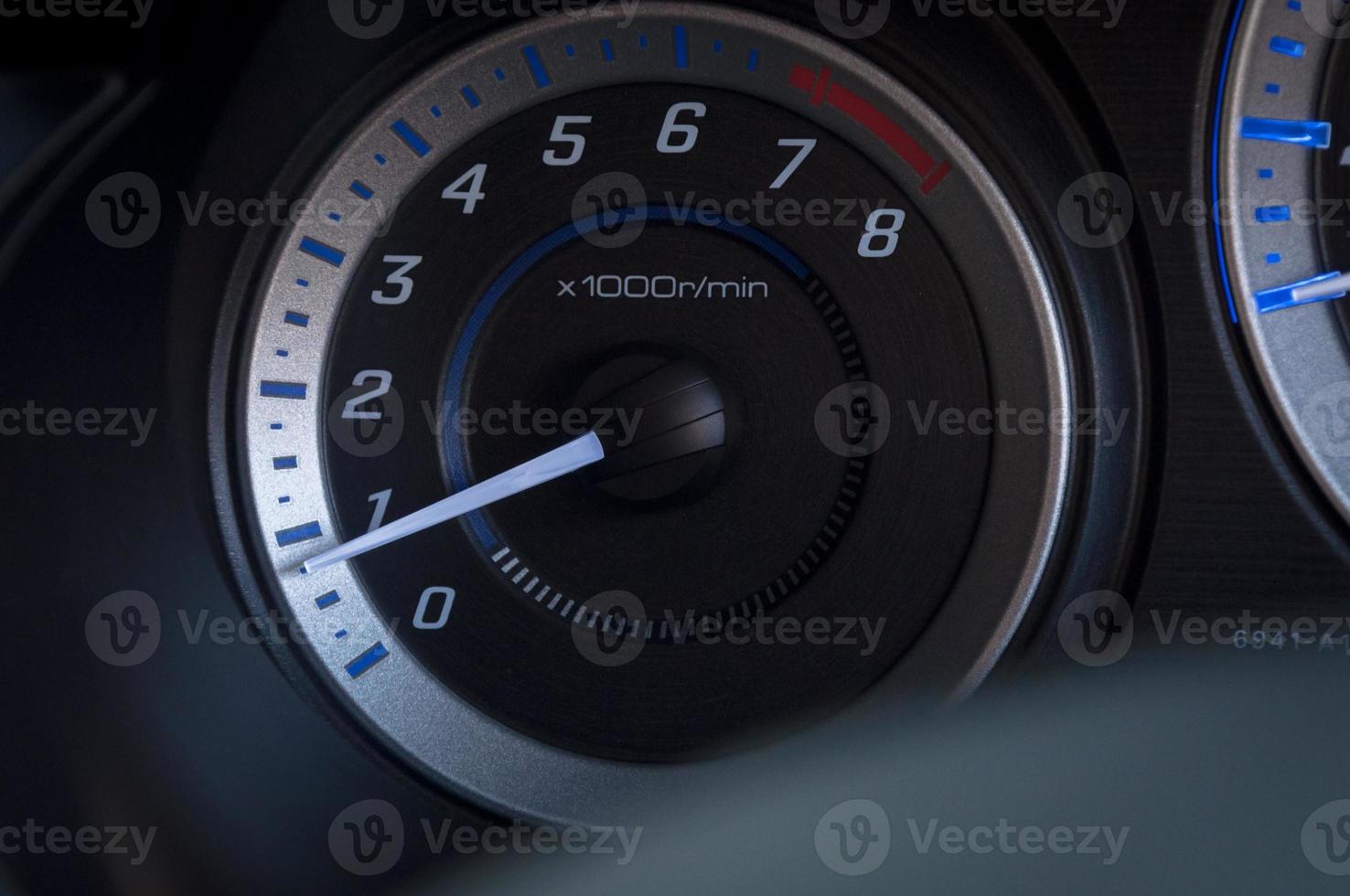 detail with the gauges on the dashboard of a car photo