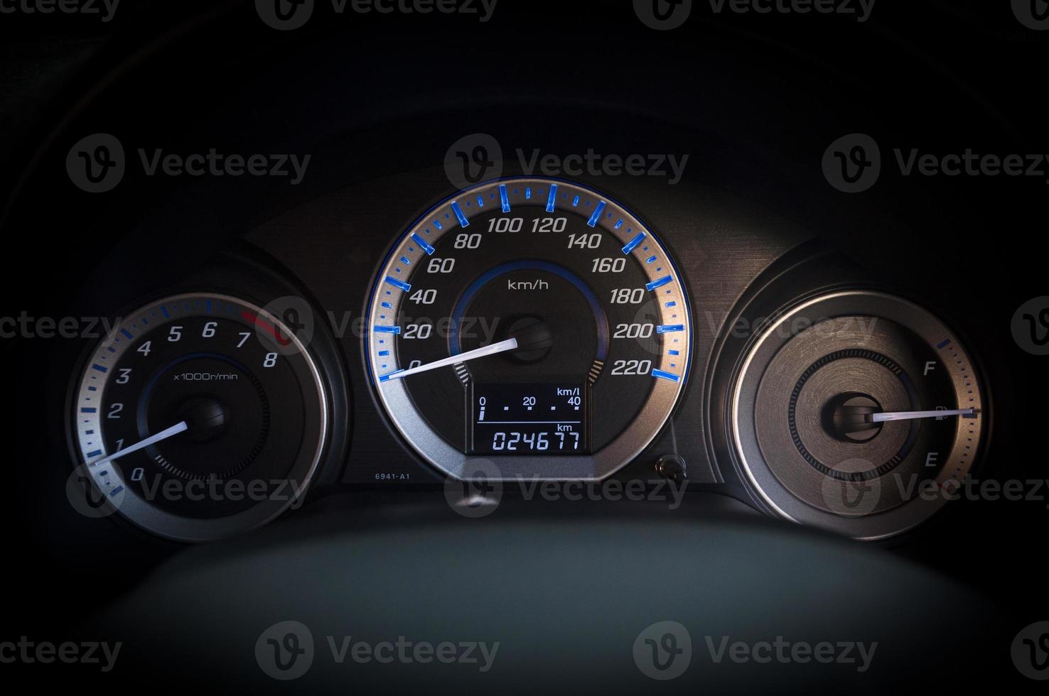 detail with the gauges on the dashboard of a car photo