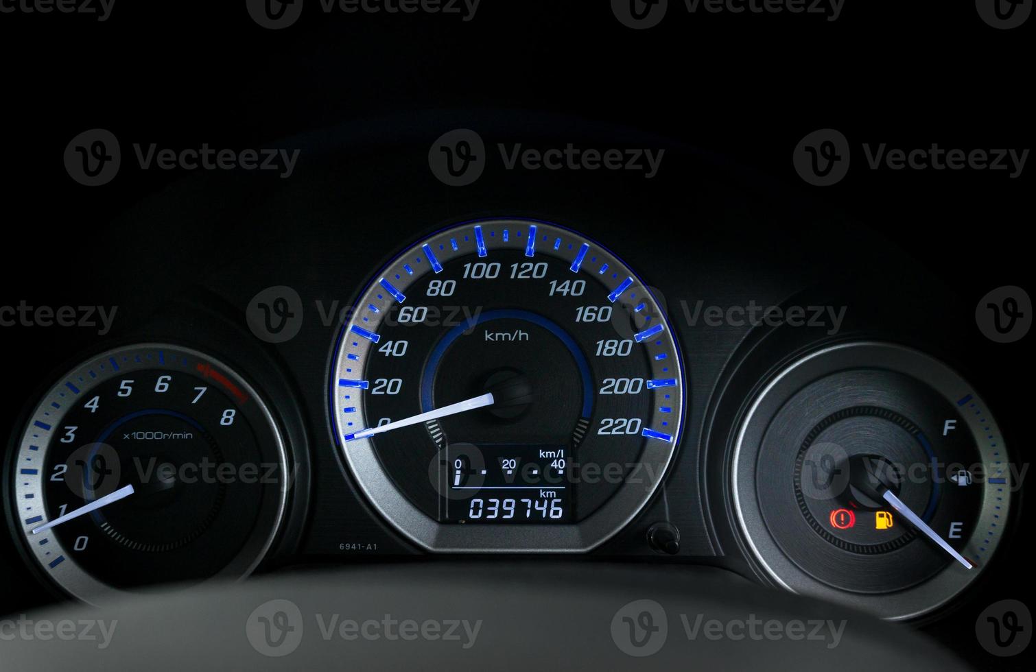 Detail with the fuel gauges showing and empty tank on dashboard of car photo