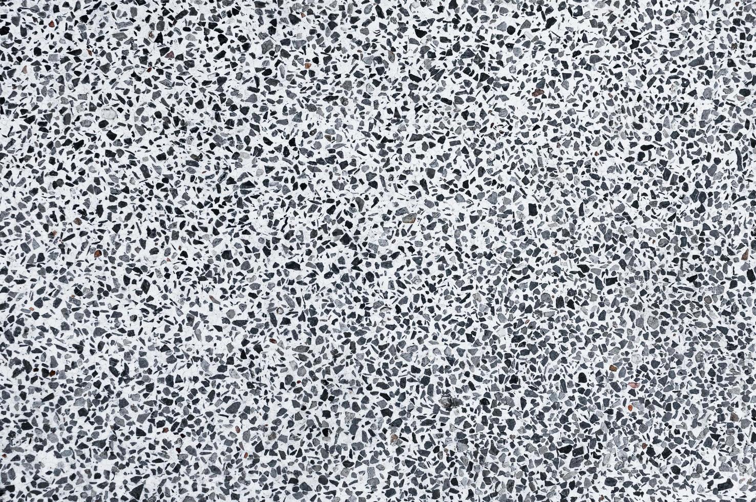Texture stone paving of black pebble wall for pattern and abstract dark background photo
