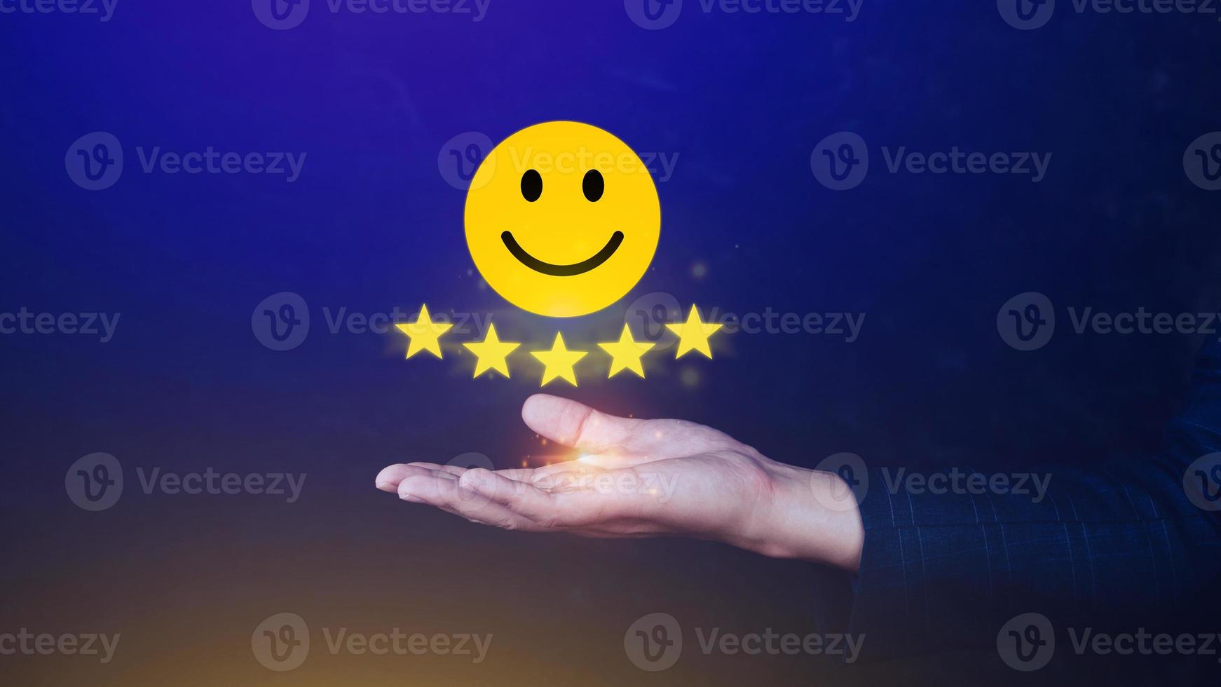 Customer services best excellent business rating experience, Positive Review and Feedback, Satisfaction survey concept. Hand of a businessman show happy smile face with five star. photo