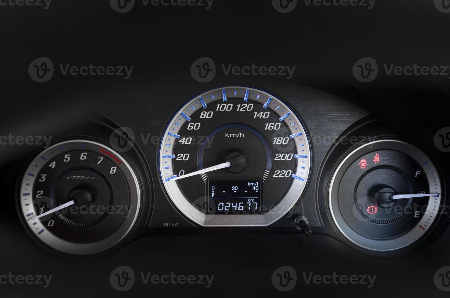 detail with the gauges on the dashboard of a car photo