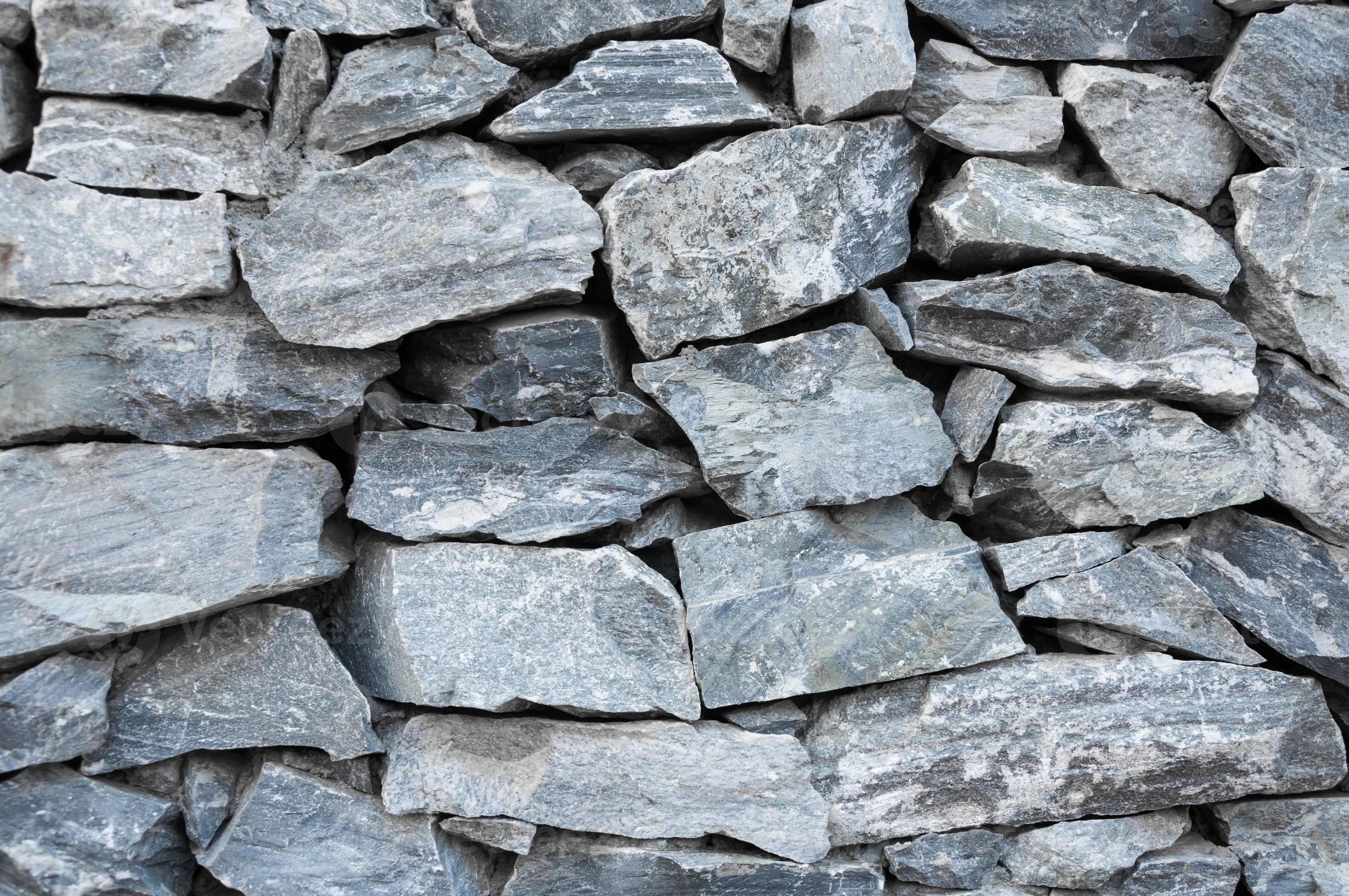 pattern decorative uneven cracked real stone wall surface with cement