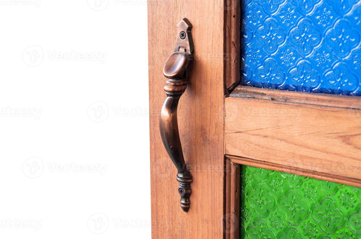 used to open the door catch,door handles color Vintage glass,Part of the wooden door, isolated on white background photo