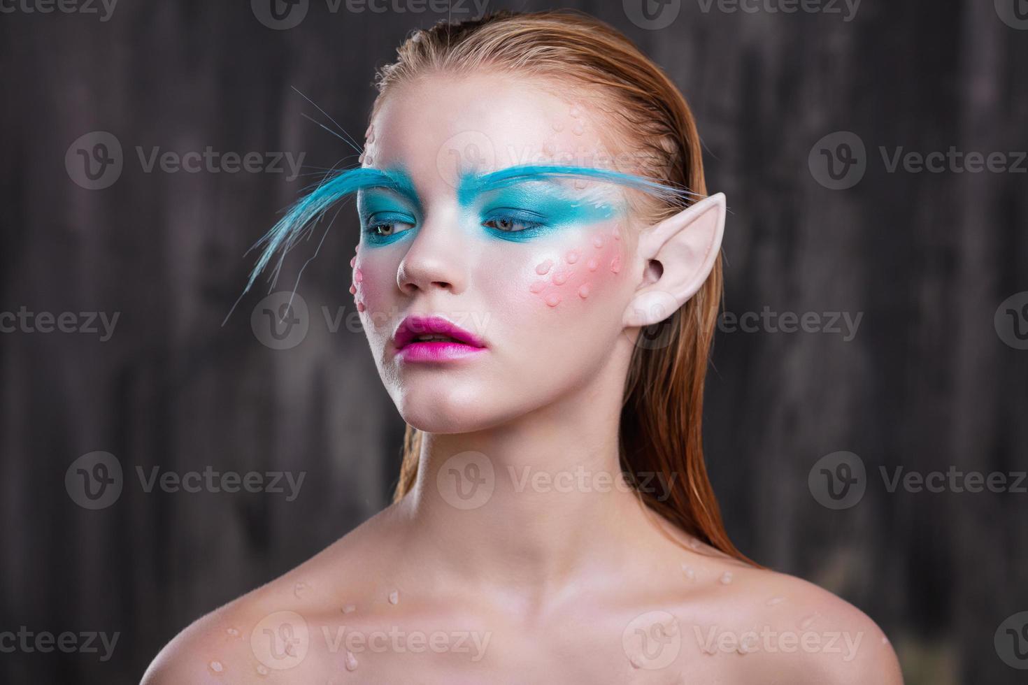 Young pretty girl with creative makeup photo