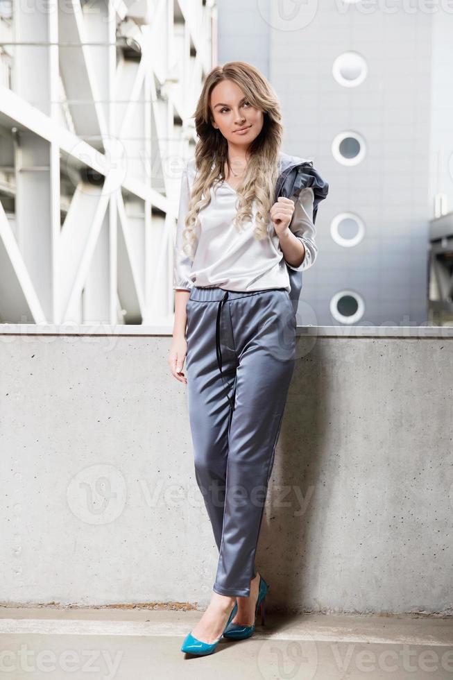 Young beautiful woman posing outdoors photo