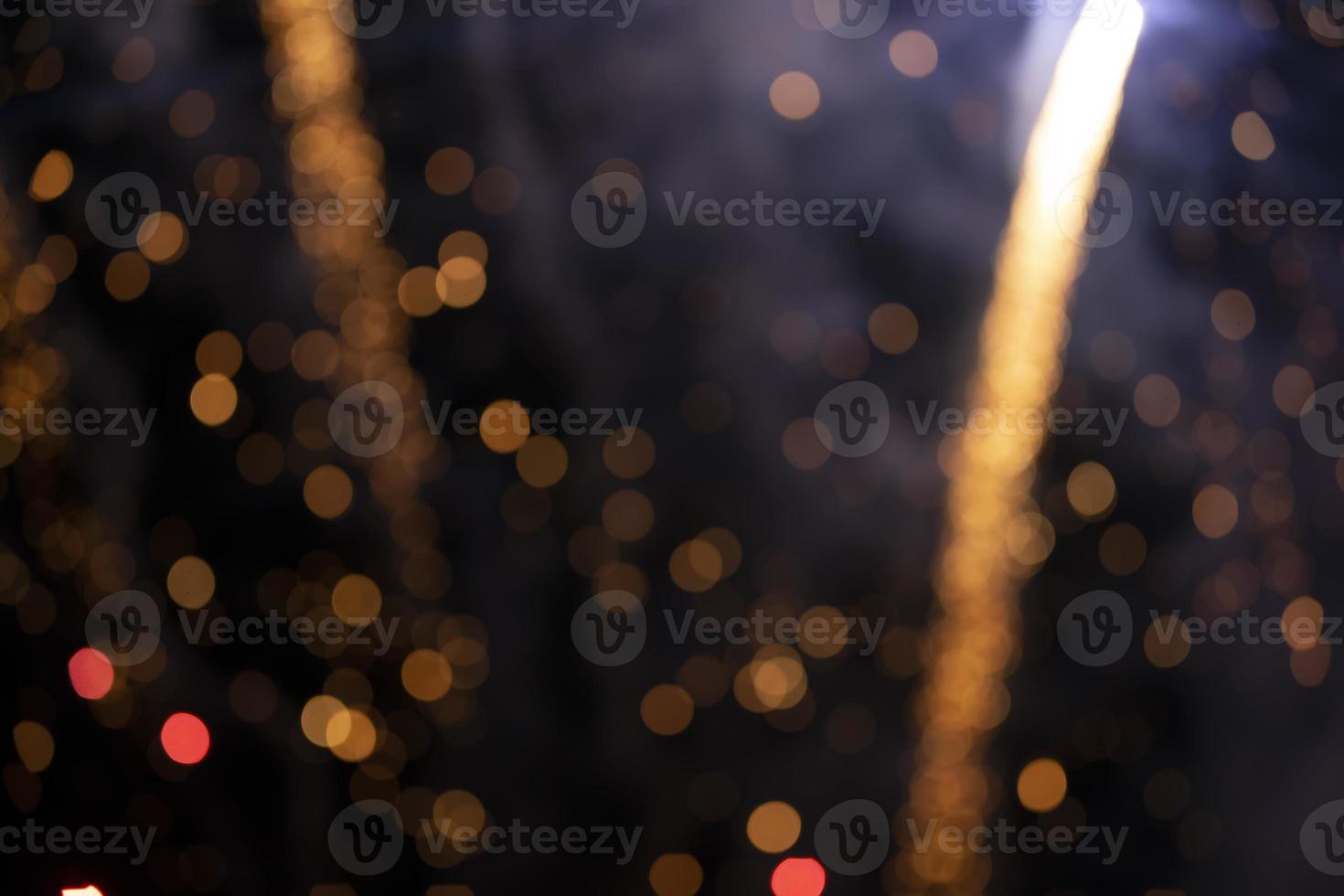 On a black background bokeh from explosions of colorful fireworks. photo